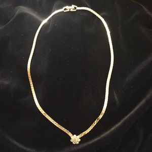Gold serpentine flat with diamond cluster